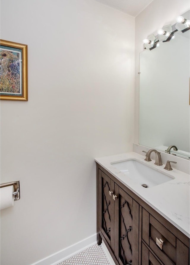 2415 Edgerton St, Little Canada, MN 55117 - bathroom with baseboards, tile patterned floors, and vanity