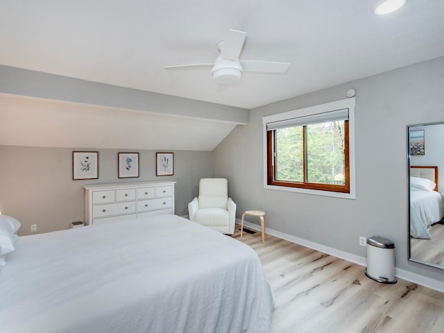2415 Edgerton St, Little Canada, MN 55117 - bedroom with light wood-style flooring, vaulted ceiling, a ceiling fan, and baseboards