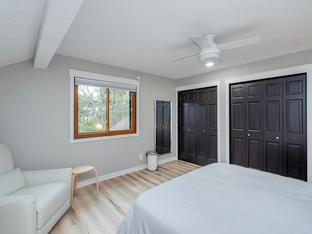 2415 Edgerton St, Little Canada, MN 55117 - bedroom with light wood-type flooring, baseboards, multiple closets, and ceiling fan