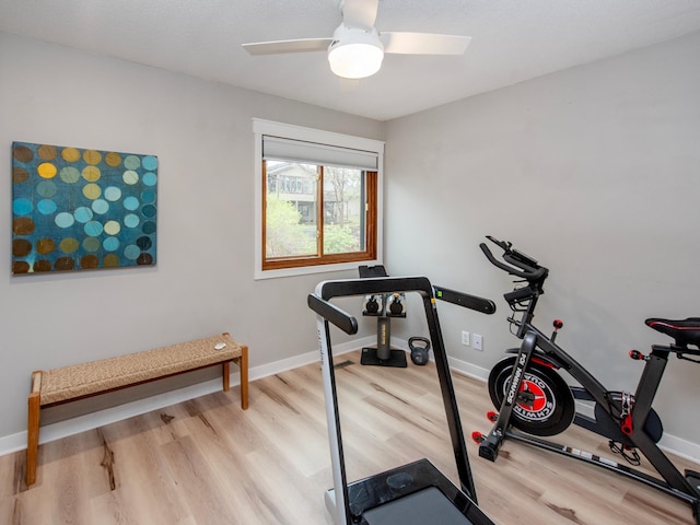 2415 Edgerton St, Little Canada, MN 55117 - workout room with wood finished floors, a ceiling fan, and baseboards