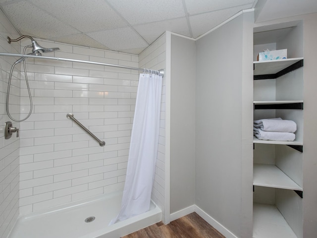 2415 Edgerton St, Little Canada, MN 55117 - full bath featuring a stall shower, wood finished floors, and baseboards