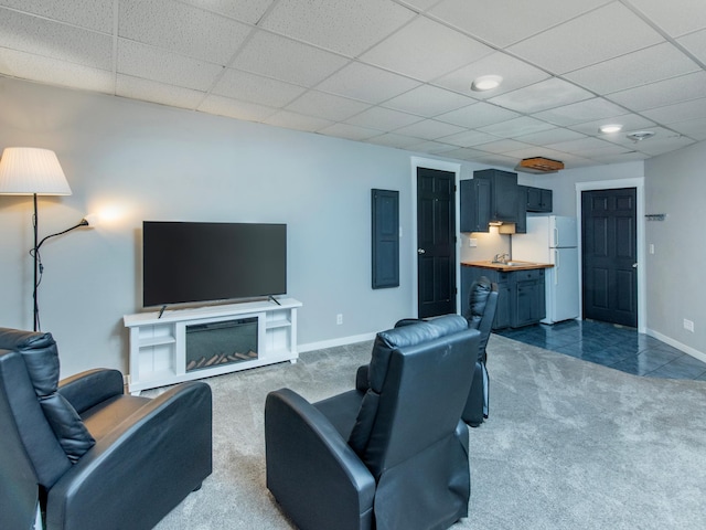 2415 Edgerton St, Little Canada, MN 55117 - living room with dark carpet, baseboards, and a drop ceiling