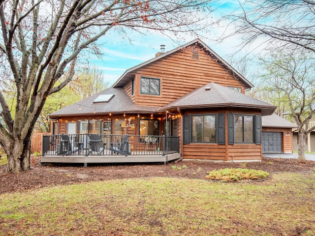 2415 Edgerton St, Little Canada, MN 55117 - back of property with roof with shingles, a deck, a yard, and a chimney