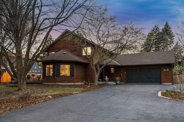 2415 Edgerton St, Little Canada, MN 55117 - view of front of house featuring asphalt driveway, a garage, and a shingled roof