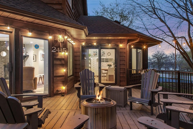 2415 Edgerton St, Little Canada, MN 55117 - deck at dusk featuring a fire pit