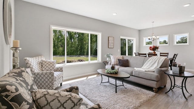 231 Emmy Ln, Hanover, MN 55341 - living area featuring recessed lighting, baseboards, a notable chandelier, and wood finished floors