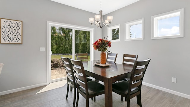 231 Emmy Ln, Hanover, MN 55341 - dining space with baseboards, a notable chandelier, and light wood-type flooring
