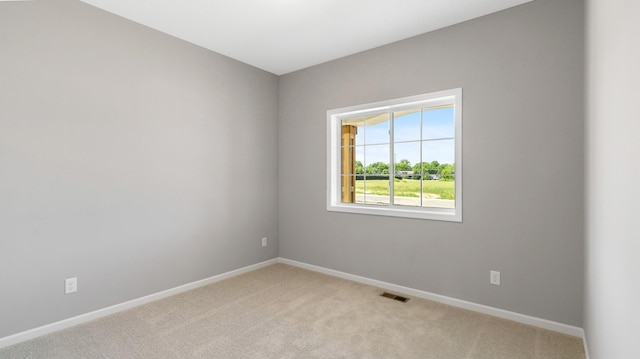 231 Emmy Ln, Hanover, MN 55341 - unfurnished room featuring baseboards, light colored carpet, and visible vents