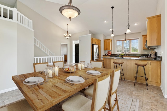 19281 Dunbury Ave, Farmington, MN 55024 - dining area with vaulted ceiling, baseboards, stairway, light stone finish flooring, and recessed lighting