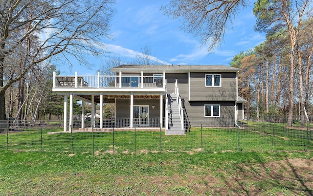 23465 7th St NE, East Bethel, MN 55005 - back of property featuring a lawn, fence, a deck, and stairway