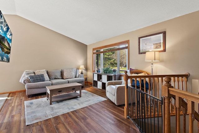 23465 7th St NE, East Bethel, MN 55005 - living room featuring baseboards, wood finished floors, and vaulted ceiling