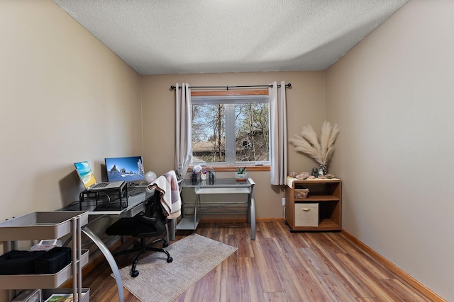 23465 7th St NE, East Bethel, MN 55005 - office area featuring baseboards, a textured ceiling, and wood finished floors