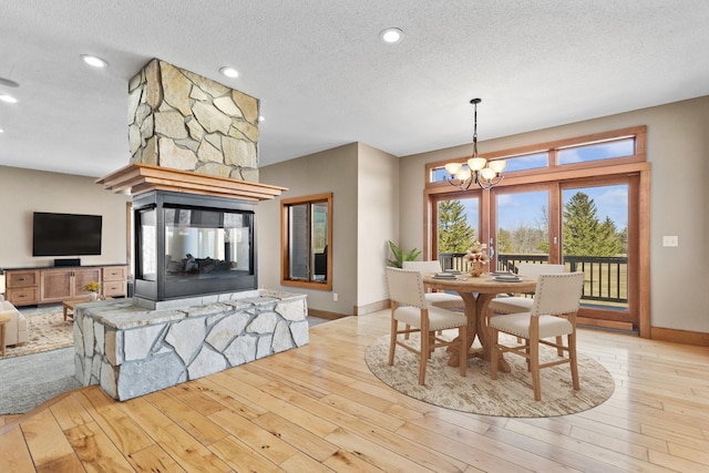 206 Fairway Cir, Glencoe, MN 55336 - dining area featuring a textured ceiling, a chandelier, hardwood / wood-style flooring, and recessed lighting