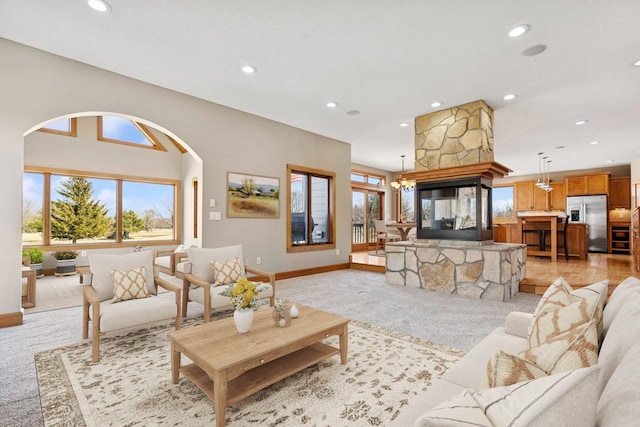 206 Fairway Cir, Glencoe, MN 55336 - living room with recessed lighting, arched walkways, and light colored carpet