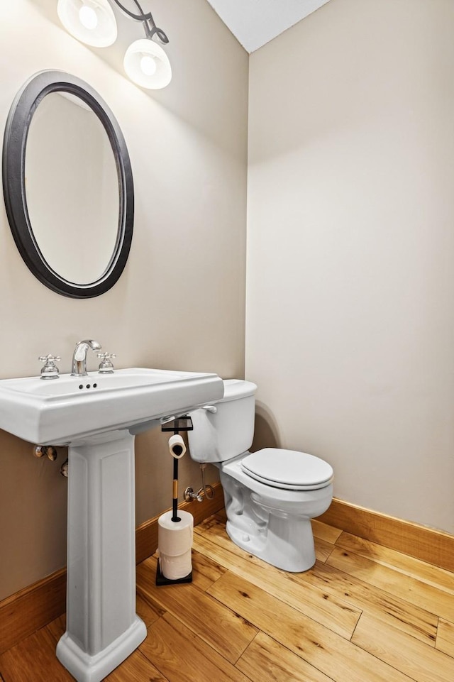 206 Fairway Cir, Glencoe, MN 55336 - half bath featuring hardwood / wood-style floors