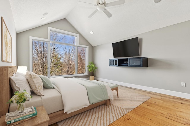 206 Fairway Cir, Glencoe, MN 55336 - bedroom with lofted ceiling, wood finished floors, a ceiling fan, and recessed lighting