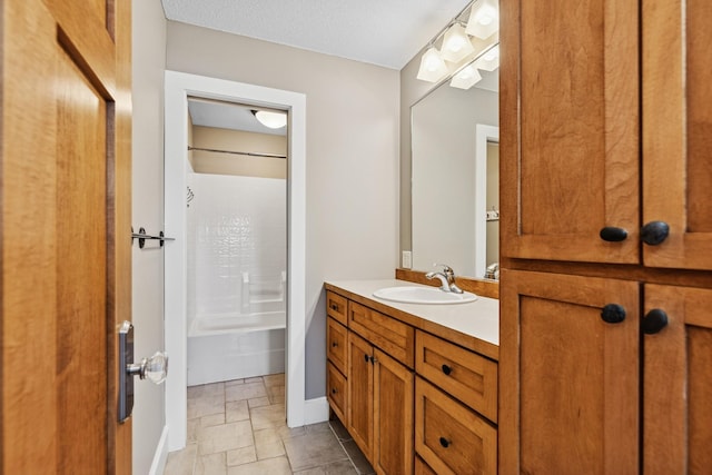 206 Fairway Cir, Glencoe, MN 55336 - full bathroom with vanity, stone tile floors, and bathing tub / shower combination
