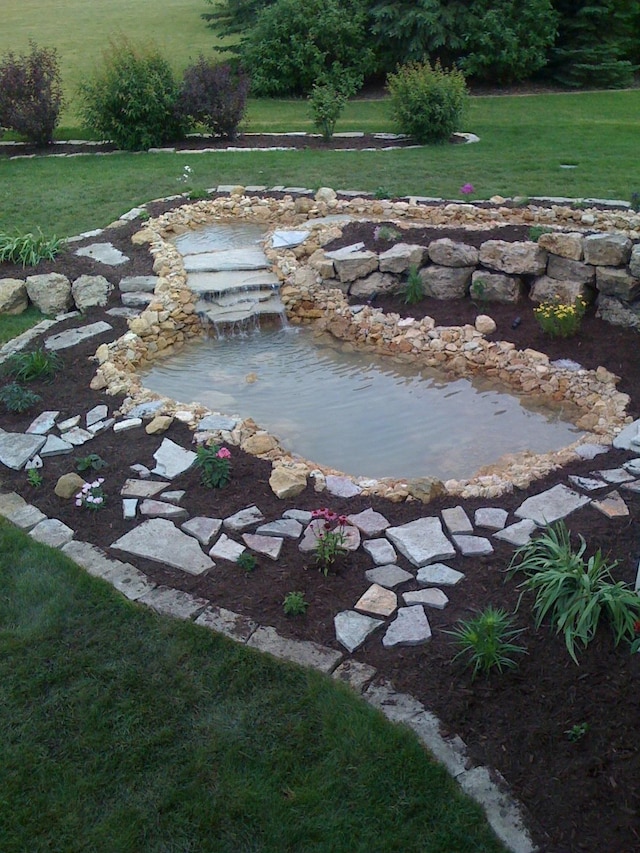 206 Fairway Cir, Glencoe, MN 55336 - view of grassy yard featuring a garden pond