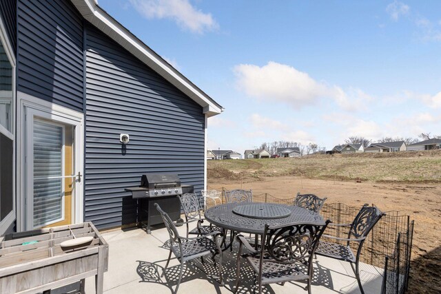 10054 Mulberry Ln, Corcoran, MN 55374 - view of patio / terrace with a grill, a residential view, and outdoor dining area