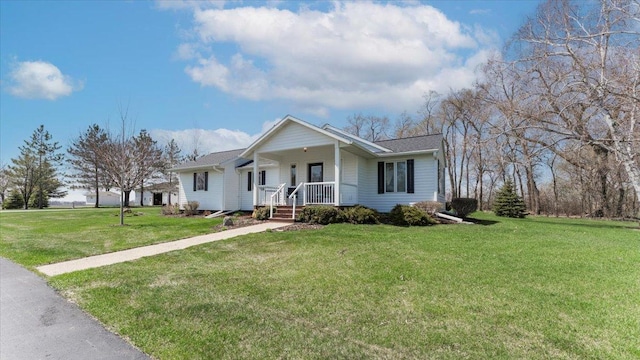 view of front of home with a porch and a front lawn