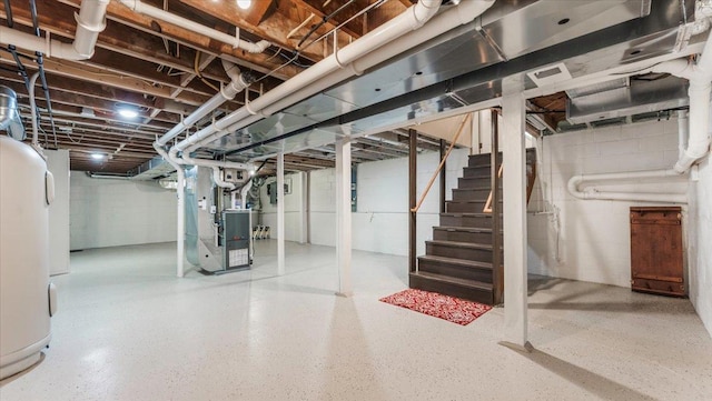 unfinished basement featuring heating unit, water heater, and stairs