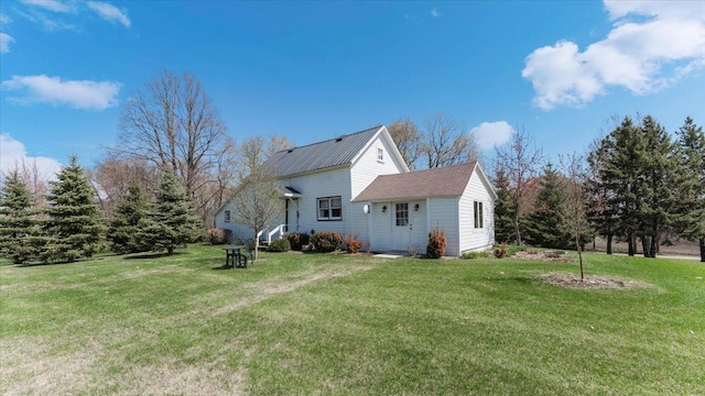 view of property exterior with a lawn