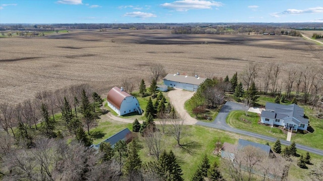 birds eye view of property with a rural view