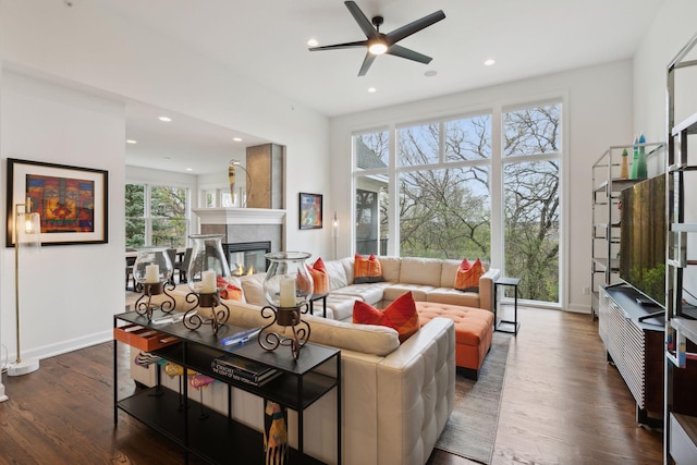 1360 Skyline Dr, Golden Valley, MN 55422 - living room featuring dark wood-style floors, a ceiling fan, a tiled fireplace, and recessed lighting