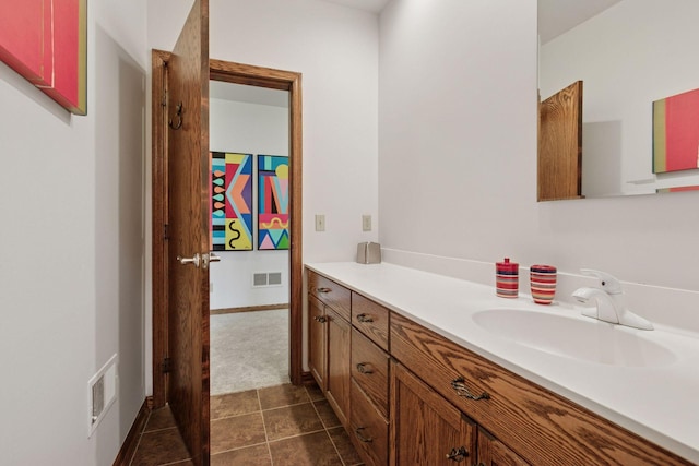 1360 Skyline Dr, Golden Valley, MN 55422 - bathroom featuring visible vents, tile patterned flooring, and vanity