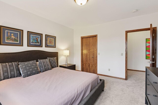 1360 Skyline Dr, Golden Valley, MN 55422 - bedroom featuring baseboards, a closet, and light colored carpet