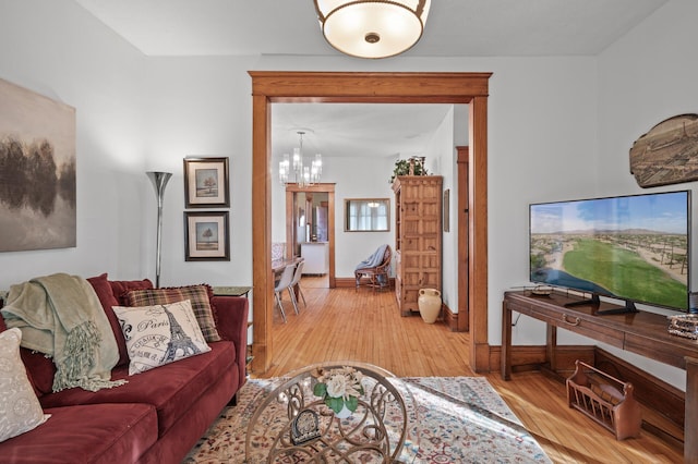 1005 Mclean Ave, Saint Paul, MN 55106 - living room featuring light wood finished floors, a chandelier, and baseboards