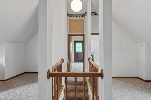 1005 Mclean Ave, Saint Paul, MN 55106 - staircase featuring vaulted ceiling, carpet flooring, and baseboards