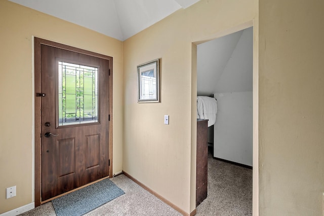 1005 Mclean Ave, Saint Paul, MN 55106 - foyer featuring lofted ceiling, baseboards, and carpet flooring