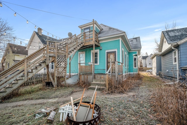 1005 Mclean Ave, Saint Paul, MN 55106 - view of front of house with a shingled roof and stairs