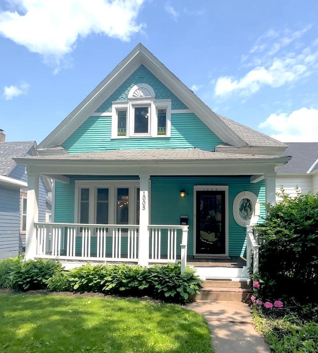 1005 Mclean Ave, Saint Paul, MN 55106 - view of front of property with a porch and roof with shingles