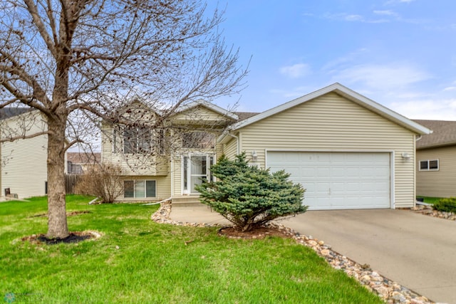 view of front of house with a garage, a front yard, and concrete driveway