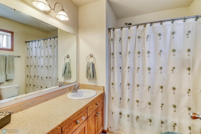 bathroom with vanity and toilet