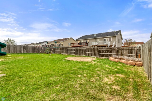 view of yard featuring a fenced backyard and a playground