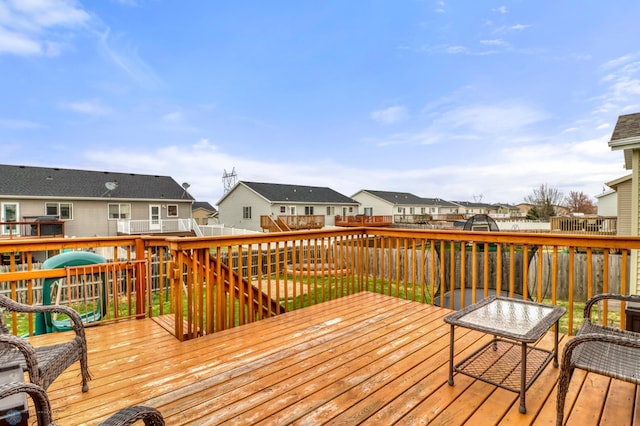 deck featuring a residential view and a fenced backyard