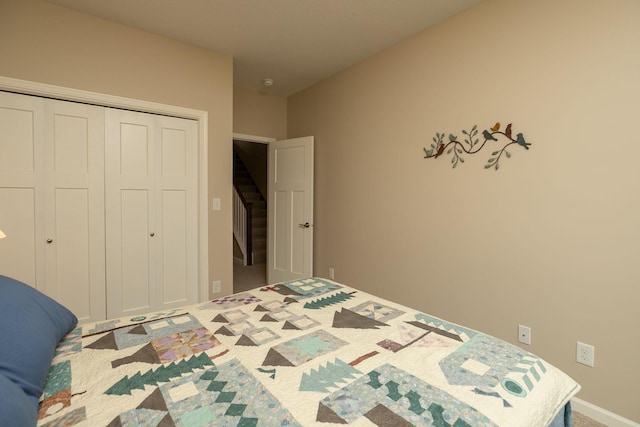 bedroom with a closet and carpet floors