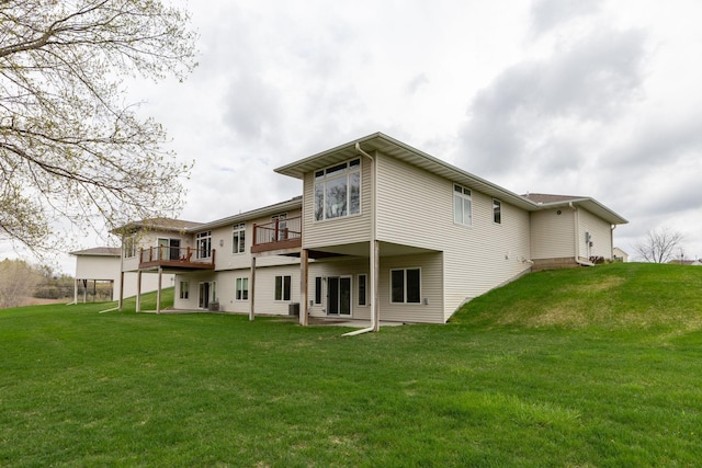back of house with a yard and a wooden deck