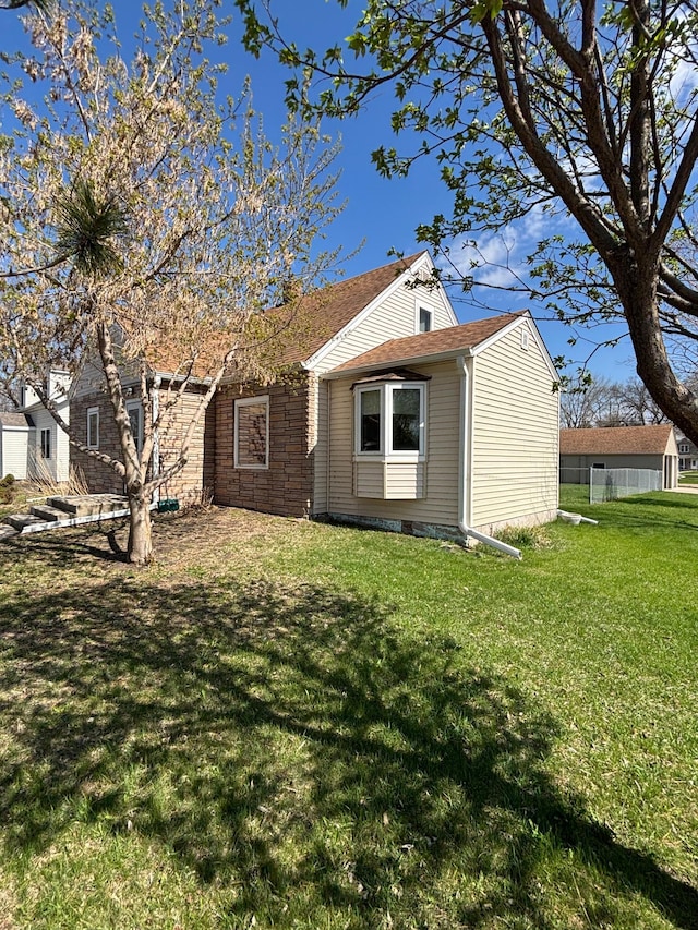 rear view of house with a lawn