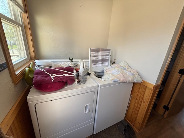 washroom featuring wainscoting and washer and clothes dryer