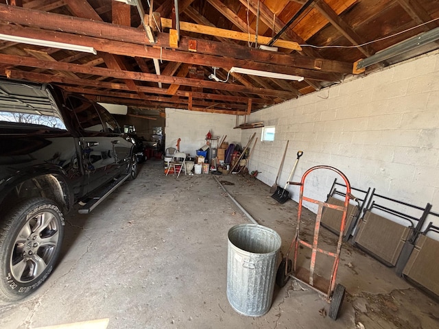 garage featuring concrete block wall