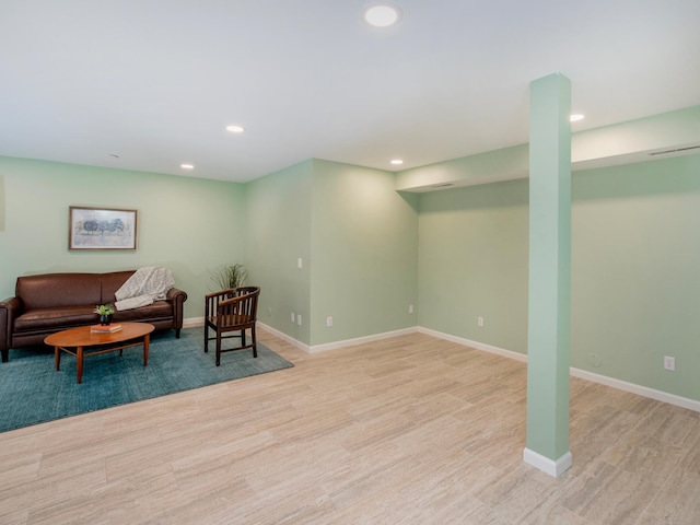 interior space featuring baseboards, recessed lighting, and light wood-type flooring
