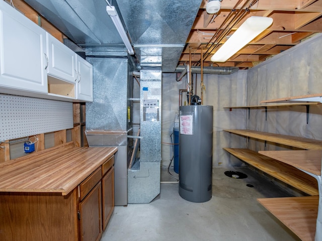unfinished basement featuring water heater and heating unit