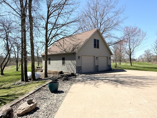 garage featuring driveway