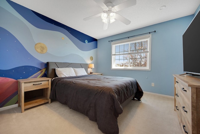 carpeted bedroom featuring baseboards and a ceiling fan