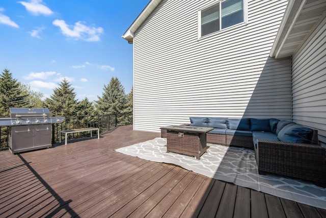 wooden terrace featuring an outdoor living space and a grill
