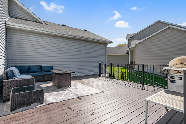deck with an outdoor living space and a grill